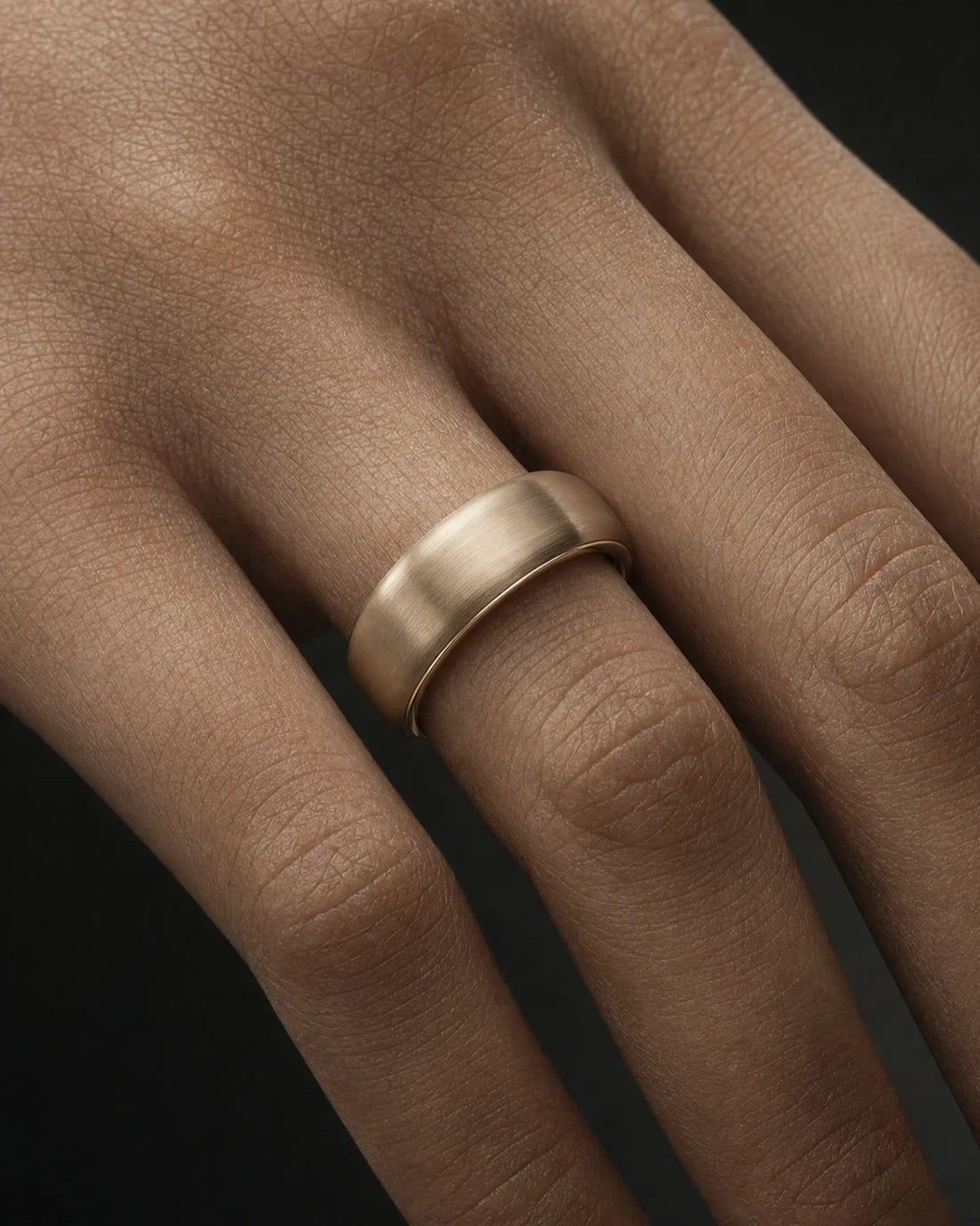 AURIA ring worn on finger